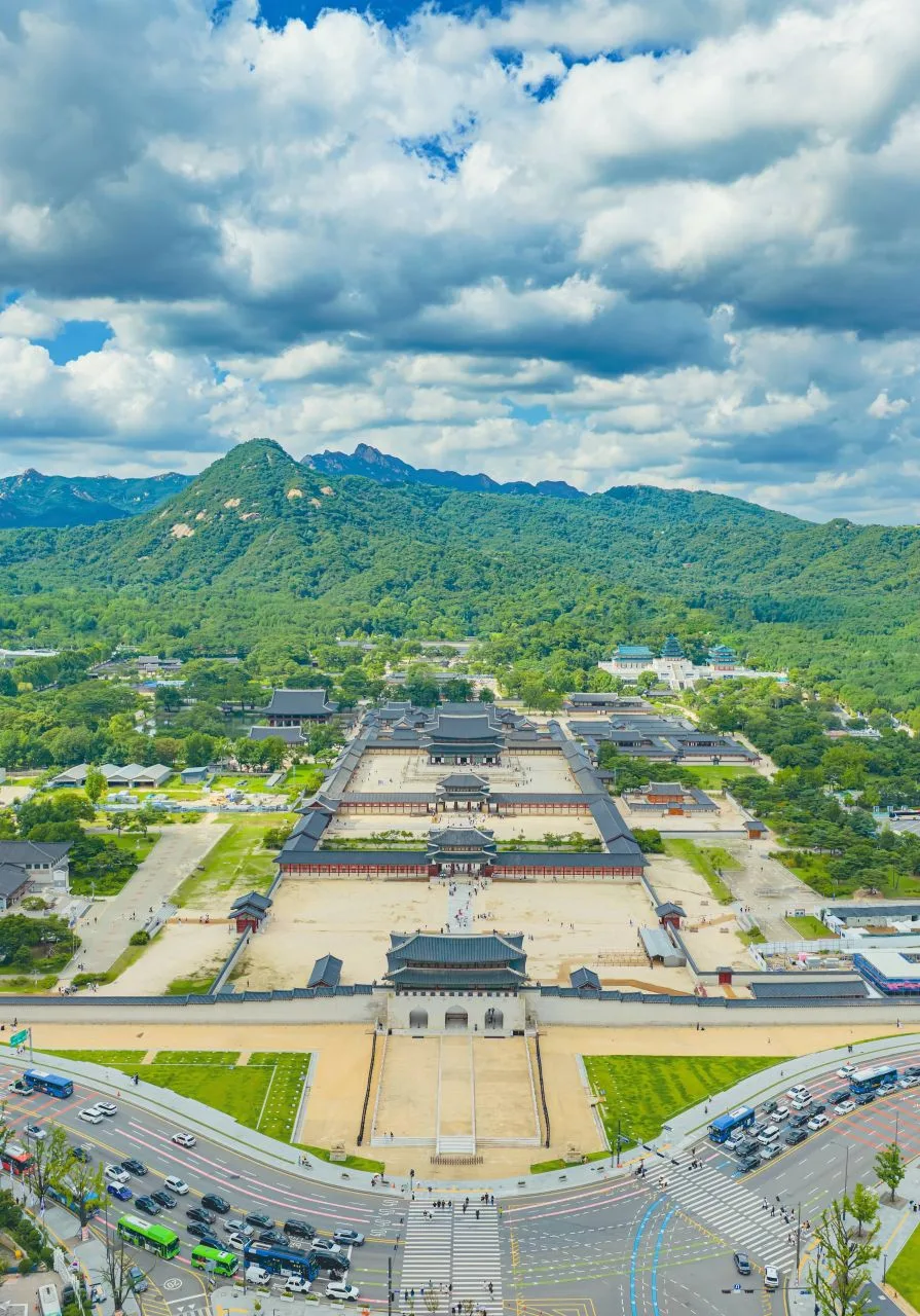 Snow settling on the tiled roofs and courtyard of Gyeongbokgung Palace in Seoul