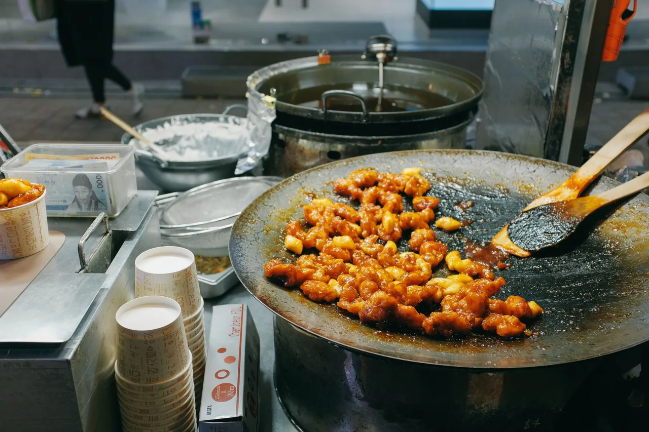 Street food carts lining Myeongdong after dark
